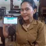 Febriyani, peserta Program JKN yang merasakan manfaat dan kemudahaan saat memanfaatkan layanan digital BPJS Kesehatan